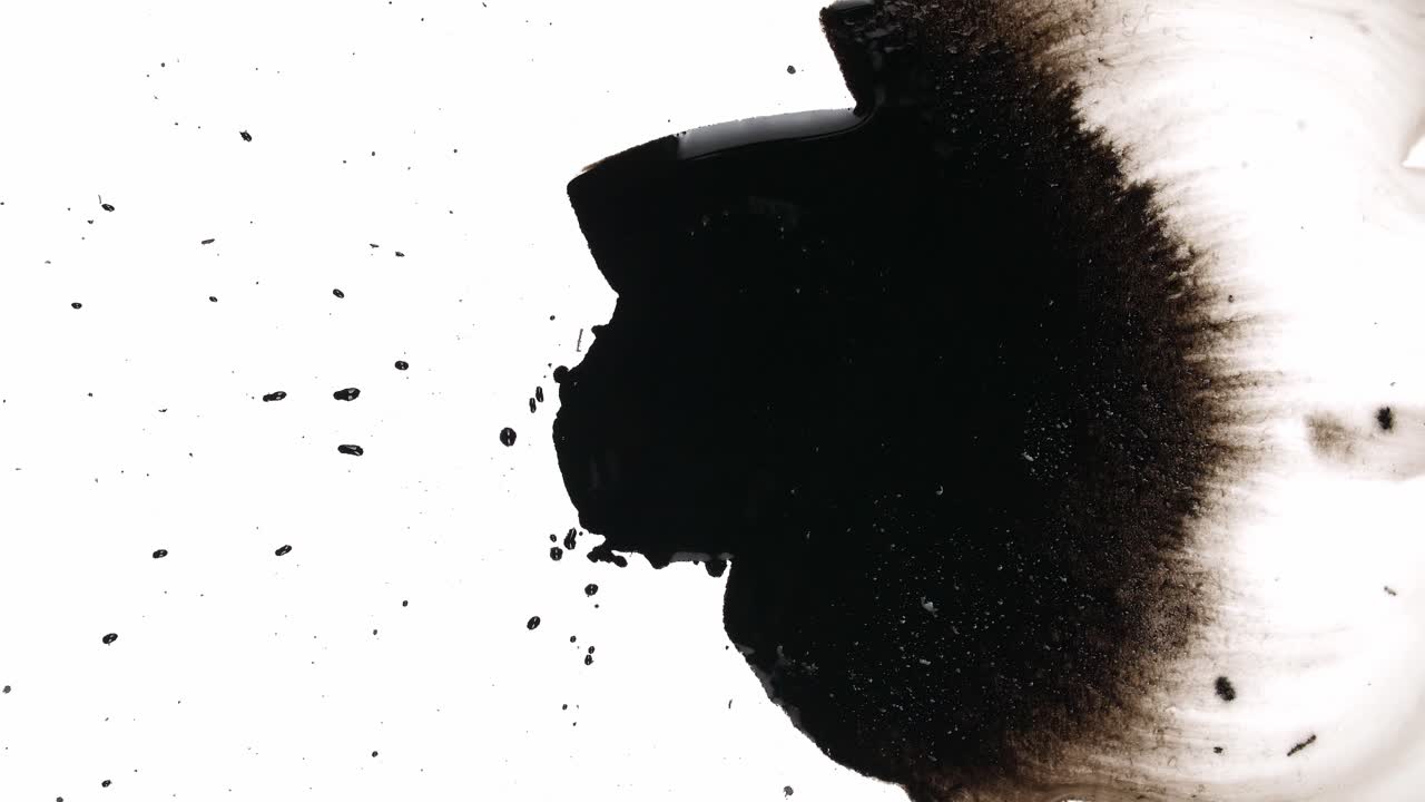 Black Ink Drops On White Background