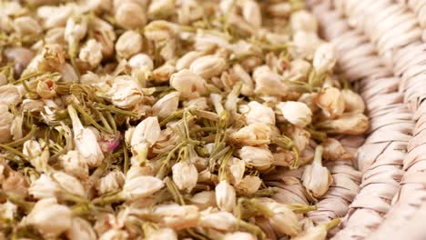 dried jasmine flowers in a basket