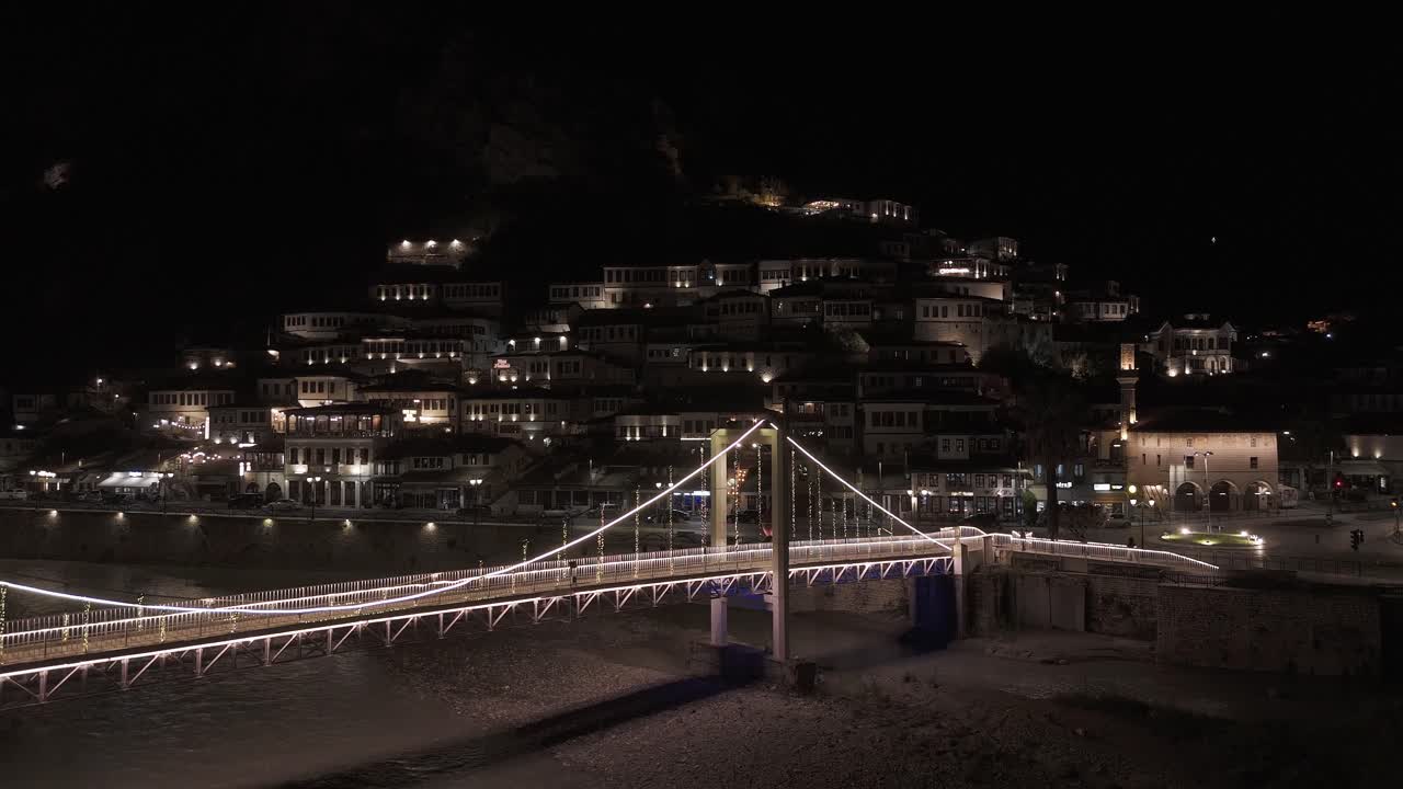 Night view of Berat, Albania, warm lights, serene mood