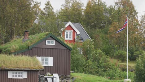 Sod-roof-cabins-and-a-modern-cabin-in-the-Norwegian-countryside