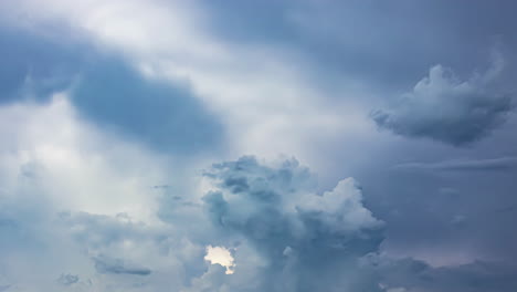 timelapse clouds forming and moving in the sky, different blue variation