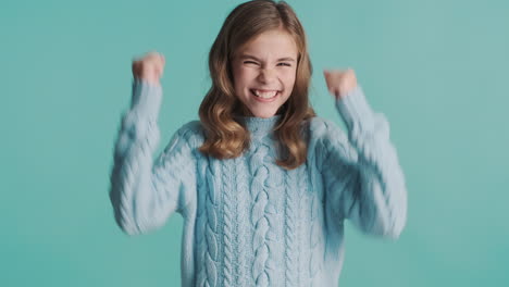 happy teenage caucasian girl in front of the camera.