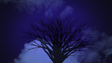 animation of white clouds moving over black silhouette of a tree on purple sky