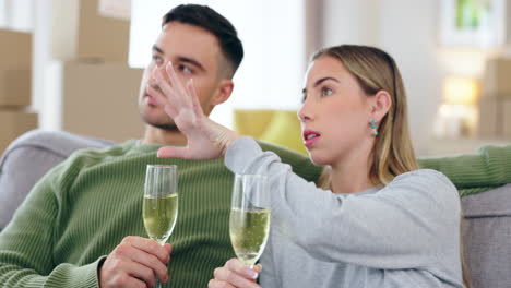 couple, champagne and together on sofa in new