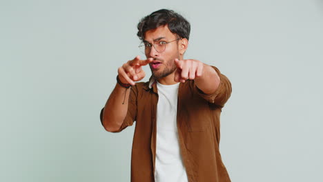 Man-pointing-at-her-eyes-and-camera-show-I-am-watching-you-gesture-spying-watching-on-someone