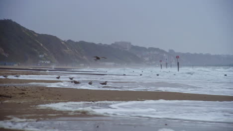 A-shot-of-Bournemouth-Beach-with-ocean-waves-and-seaguls