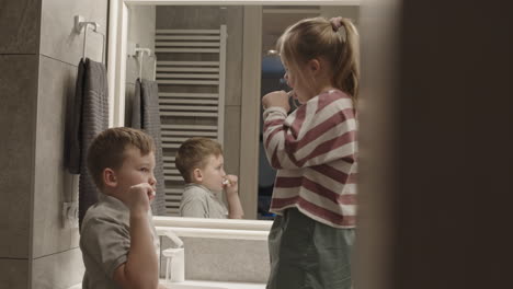 Children Brushing Teeth in Bathroom
