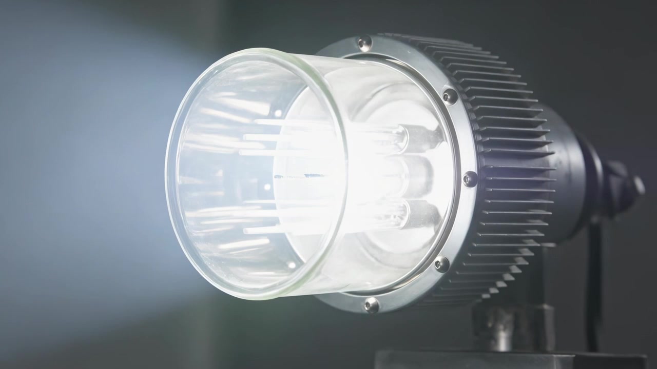 Flipping switch sending mounted spotlight fixture shifting to high beam in studio, revealing lens
