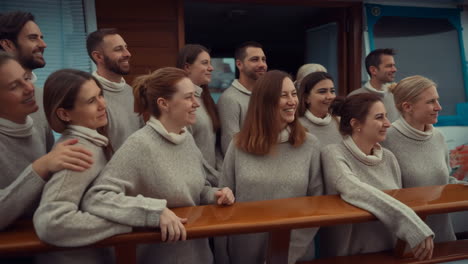 a cheerful group of people smiling on a boat deck