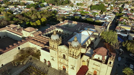 Aerial-View-of-Santo-Domingo-Church-and-Cityscape-of-Oaxaca-Mexico,-Iconic-Landmark-and-Downtown-Neighborhood-on-Golden-Hour-Sunlight