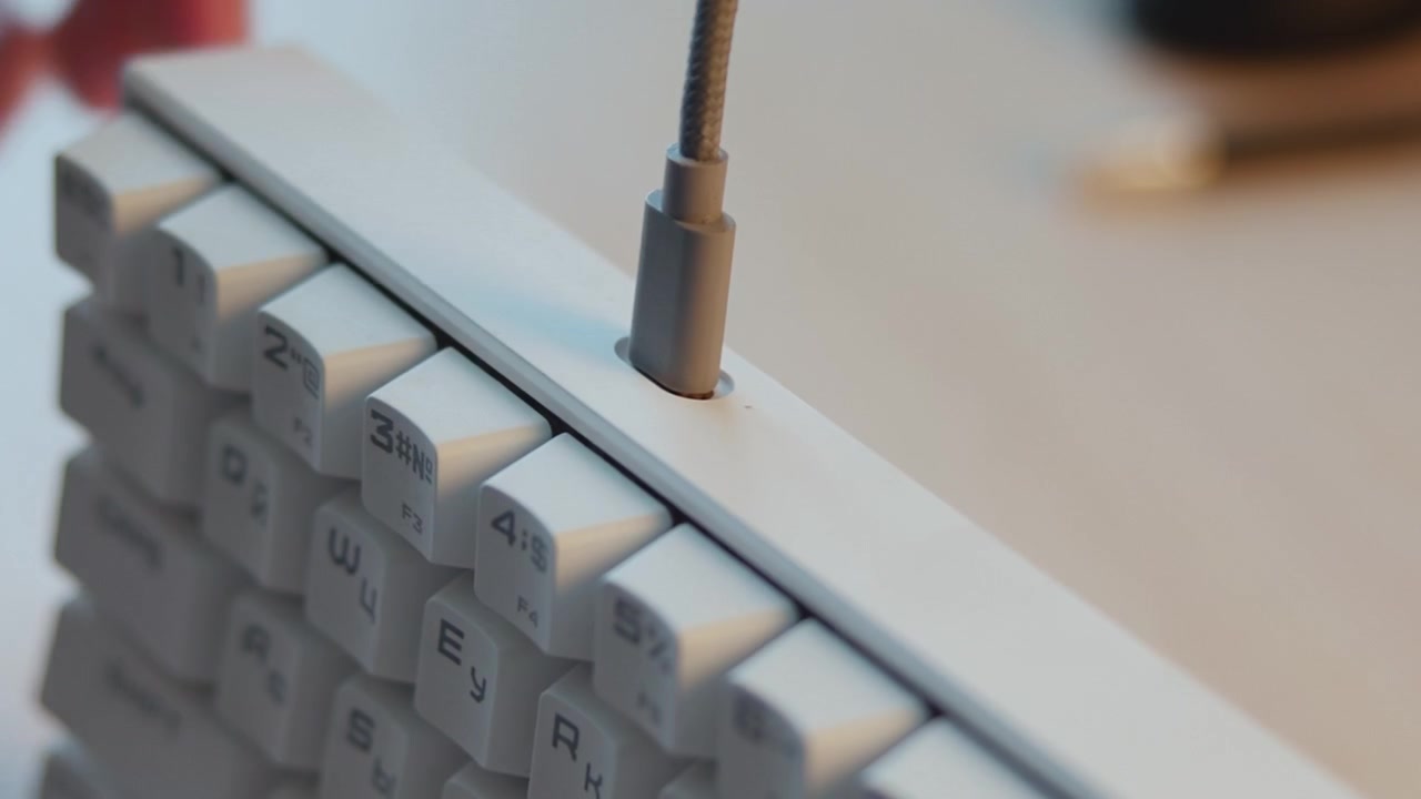 White Hand Inserting Cable Into Mechanical Keyboard Port, Close Detail On Keys And Connector, Tech Setup