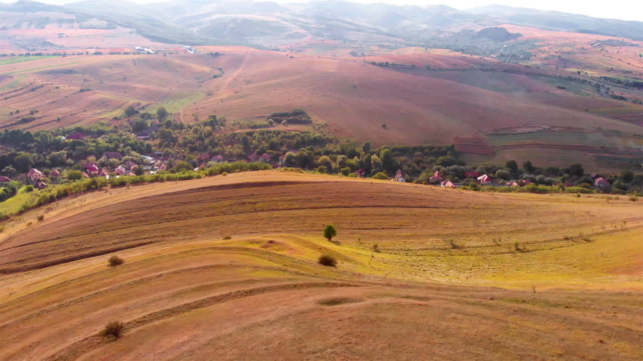 Aerial footage over Large Cross with Romania flag on High Hill and landscape at Summer