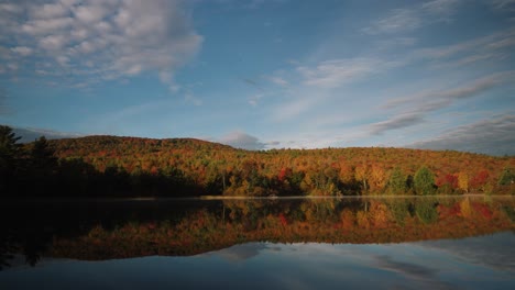 beautiful timelapse of fog on perfectly calm water during sunrise with amazing reflection