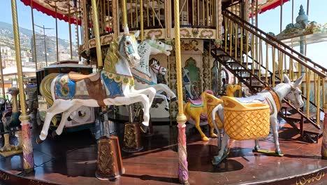 colorful carousel with horses and carriages