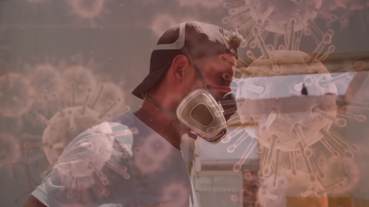 코로나19 세포가 배경에 가스 마스크를 착용한 남성에 퍼지고 있습니다.