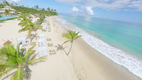 Luxurious-tropical-hotel-resort-with-palms-and-white-sand-beach-in-Punta-Cana