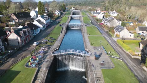 drone flies away from locks in canal above loch ness, scotland