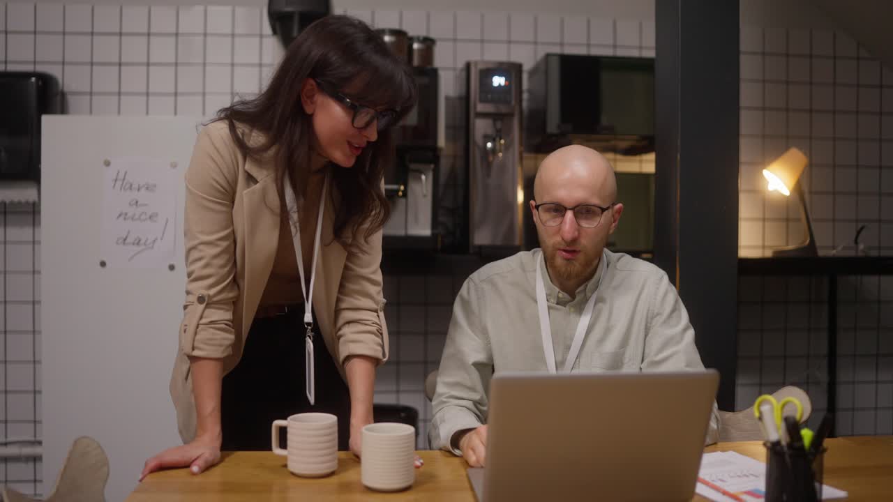 Coworkers discussing work at the office