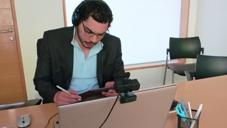 man using tablet for remote project coordination