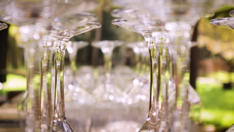 glasses are stacked at a wedding reception