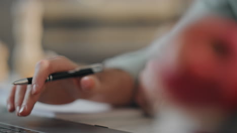 focused businessman working remotely scrolling touchpad on modern laptop closeup