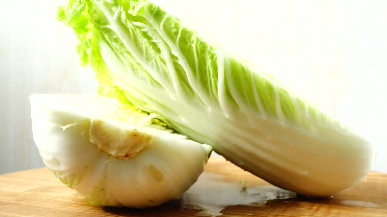 Napa cabbage, shooting in the movement. Cuttig board