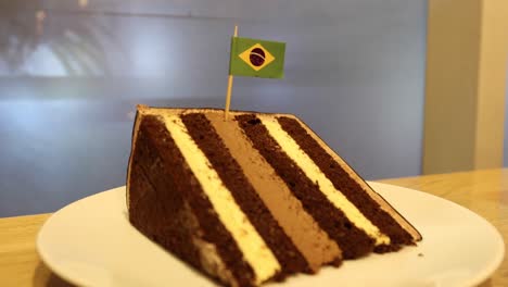 chocolate and cream cake on a plate on table