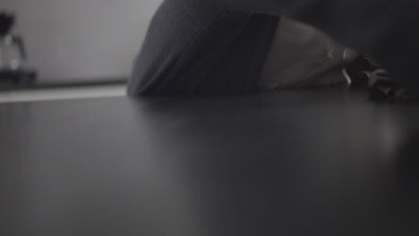 adult female woman cleaning kitchen countertop using cloth, indoors