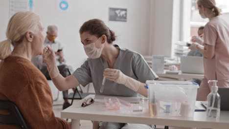 nurse collecting dna sample from patient