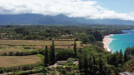 low aerial dolly shot of the kaua'i north shore coastline near princeville in hawai'i