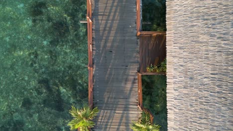 top-down shot overhead a private villa walkway in sipadan water village