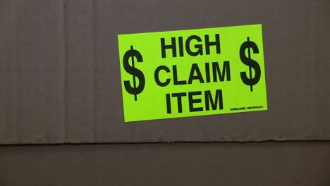 High-Claim-Item-sticker-on-the-side-of-a-cardboard-box-shipping-package