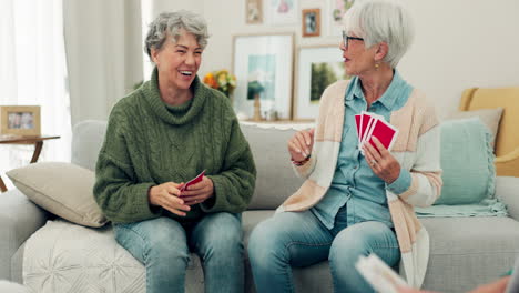 Elderly-group,-high-five-and-playing-card-game