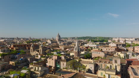 Forwards-fly-above-old-buildings-and-landmarks-in-historic-city-centre-on-sunny-morning.-Rome,-Italy