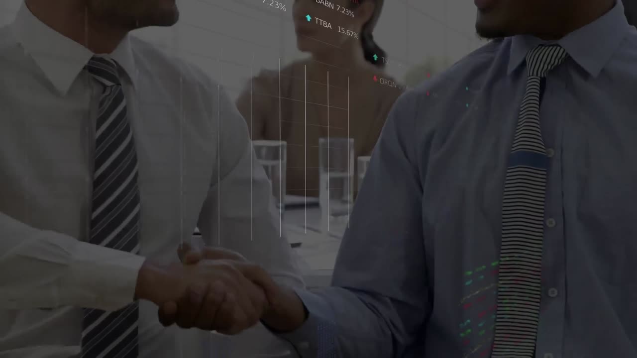 Stock market data processing against two diverse businessmen shaking hands at office