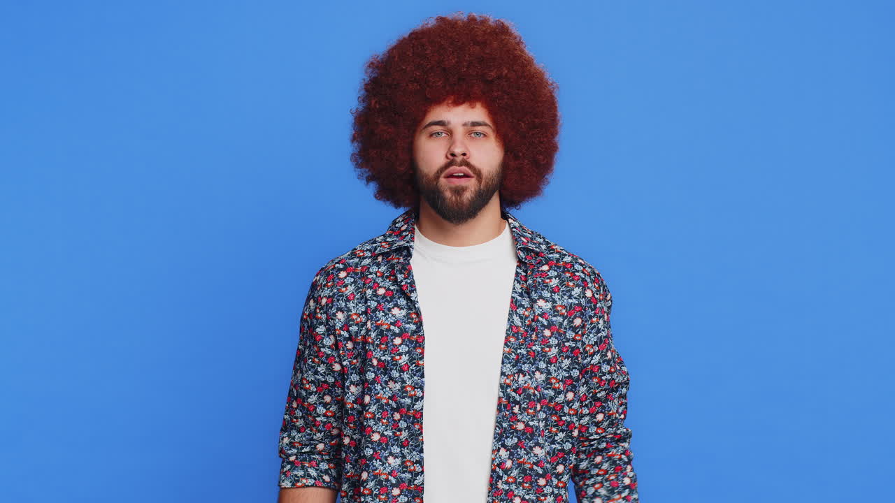 Happy man looking confident showing biceps feeling power strength to fight for rights success win