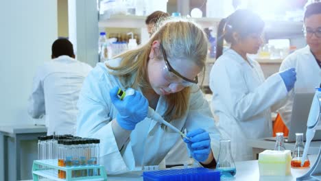 Female-scientist-experimenting-in-laboratory-4k