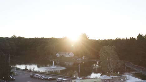 low angle drone view of luxurious mansion and sunset reveal
