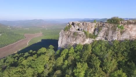 aerial view of a cliff with caves