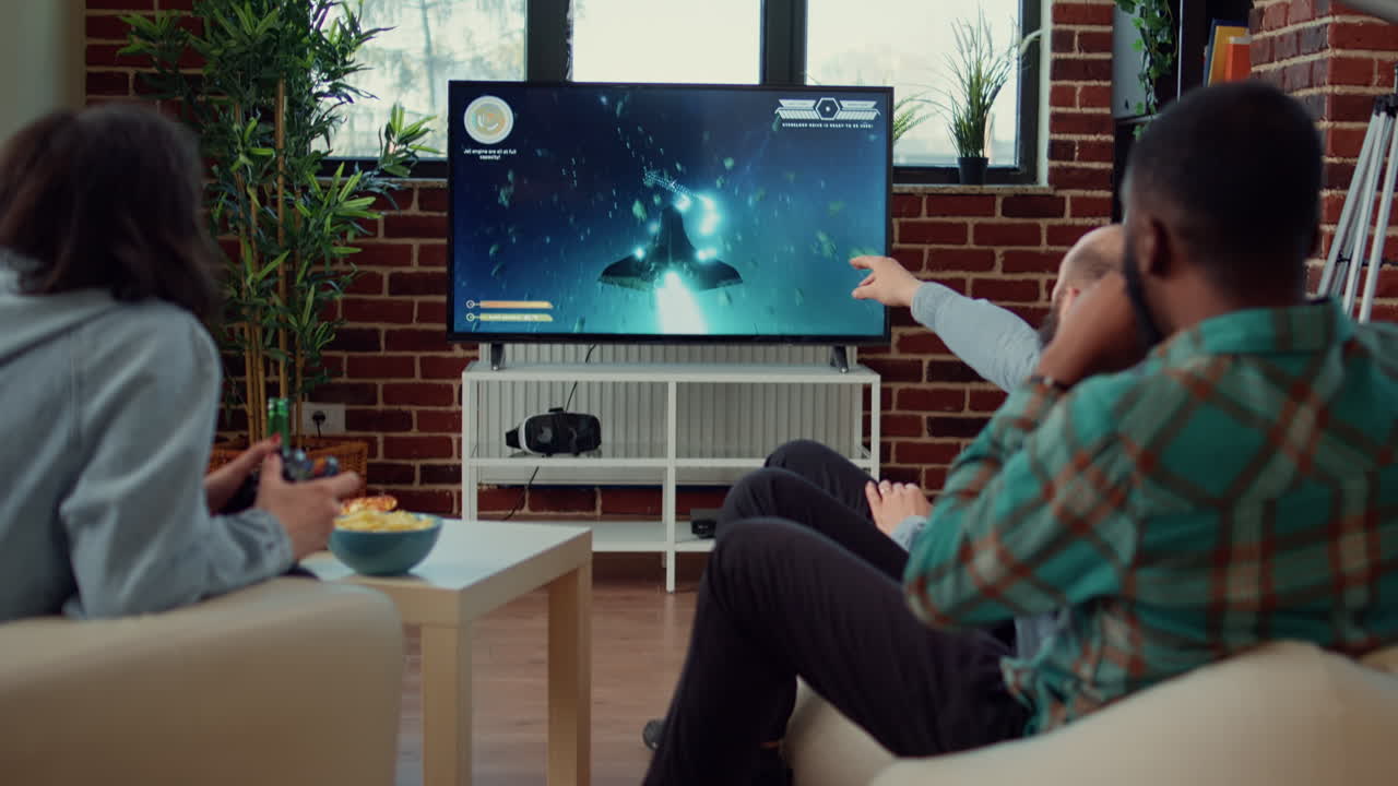 Multiethnic group of people playing video games online