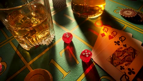 casino table with drinks, dice, and cards