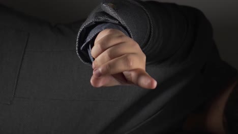 man holds out arm and simulate clicking with finger, place for product