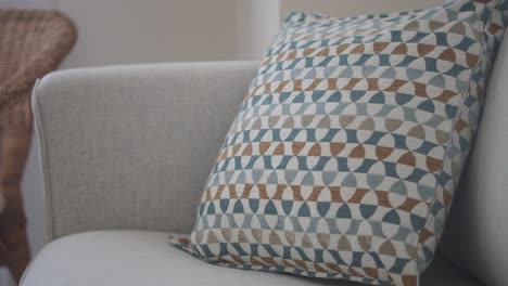 stylish throw pillow on light beige sofa