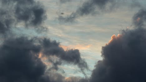 Birds-Flying-Across-Big-Dramatic-Clouds-Catching-Golden-Sunlight-During-Sunset-Australia-Maffra-Gippsland-Victoria