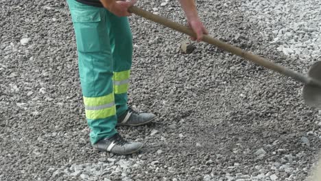 worker with shovel at construction works