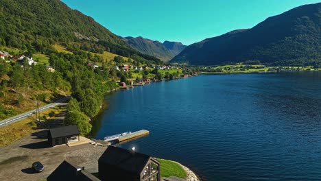 Aerial-over-Syvde-waterfront-on-a-lovely-sunny-day,-Vanylven-Municipality,-Norway