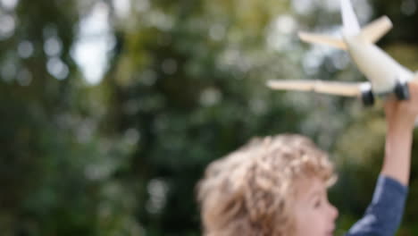 little-boy-playing-with-toy-airplane-happy-child-playing-game-running-imagining-travel-freedom-having-fun-outdoors-in-sunny-park-enjoying-childhood-4k