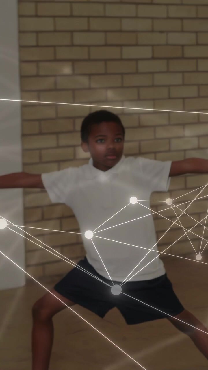 Vertical video: Glowing nodes appearing on blue mat, boy shifting, web linking students for school