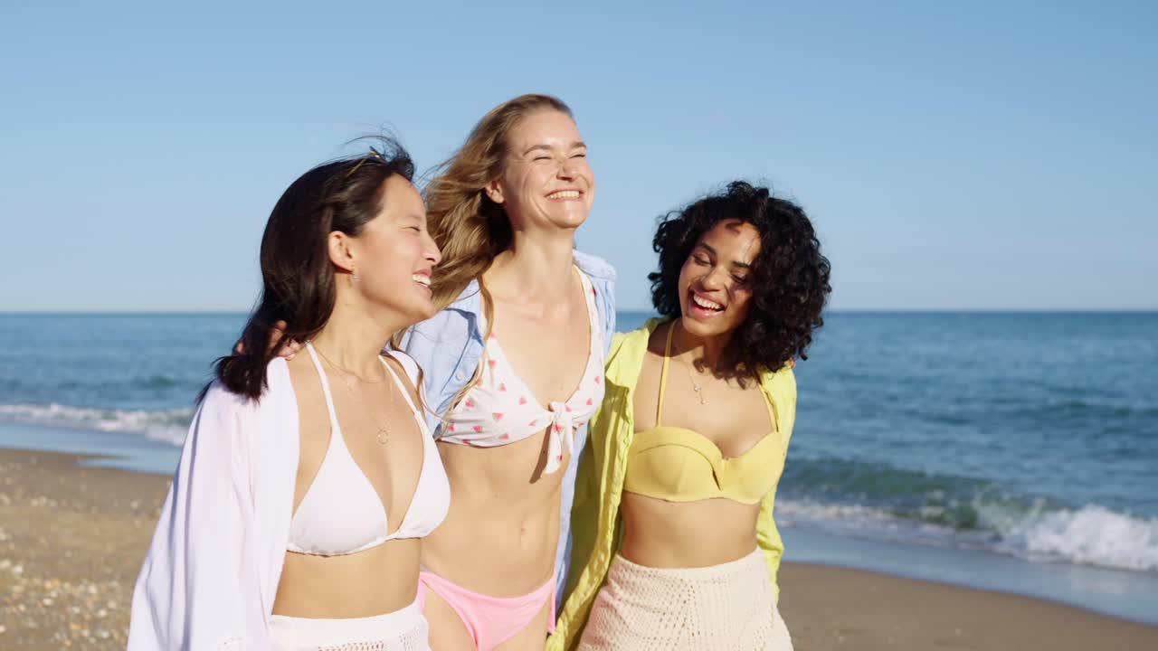 Three women friends enjoying summer at the beach