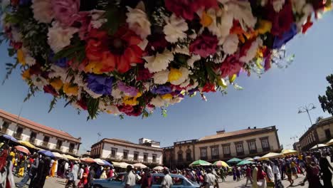 large flower arrangement in a busy market square